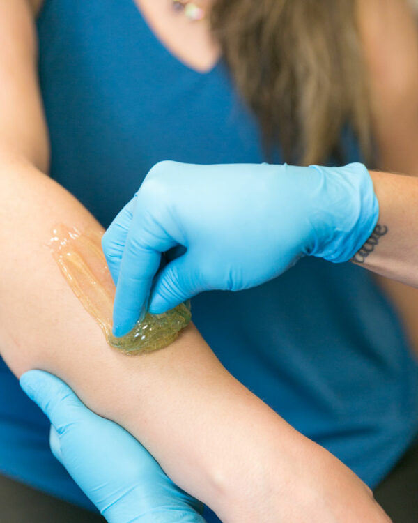 sugaring-arm sugaring on a woman's arm